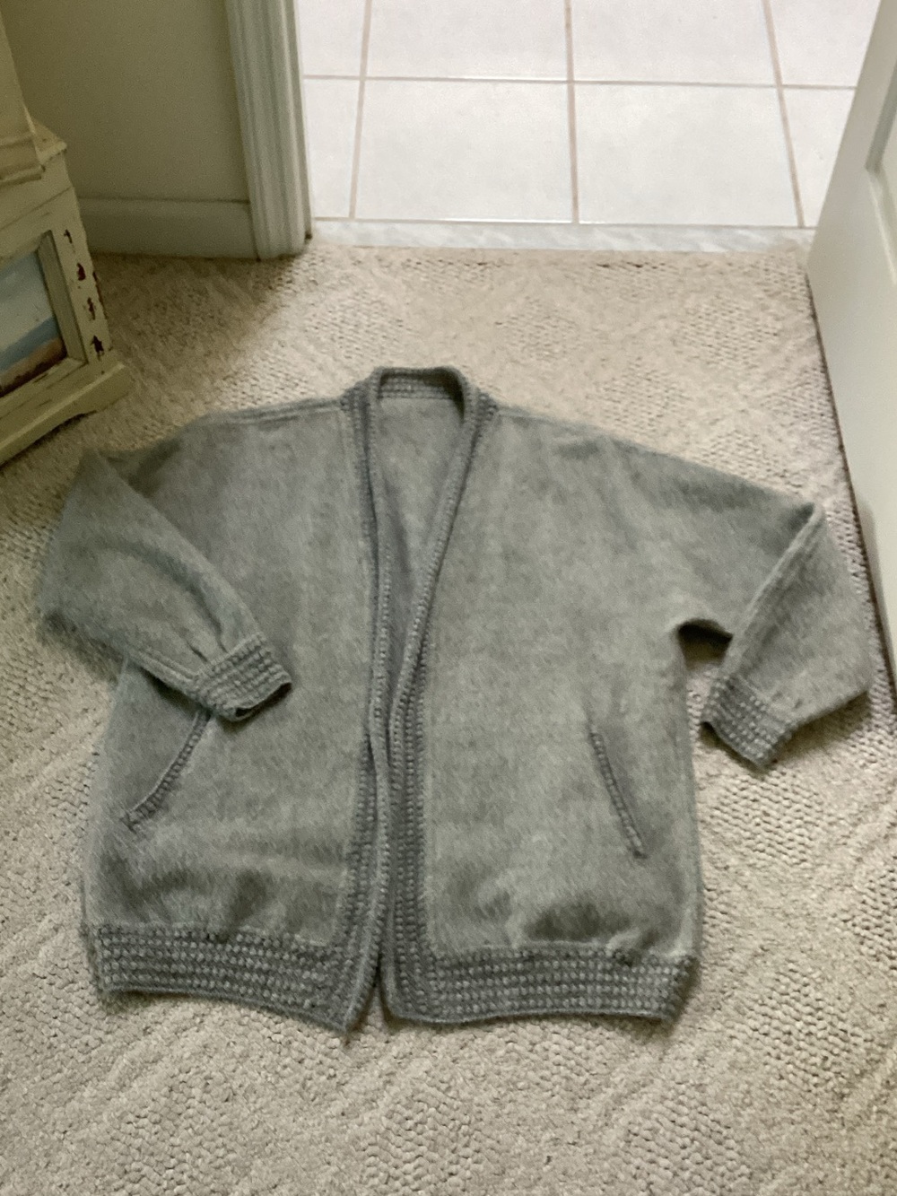 Ccahuantico 100% baby alpaca cardigan. Crocheted trim.Dolman sleeves. Pockets.